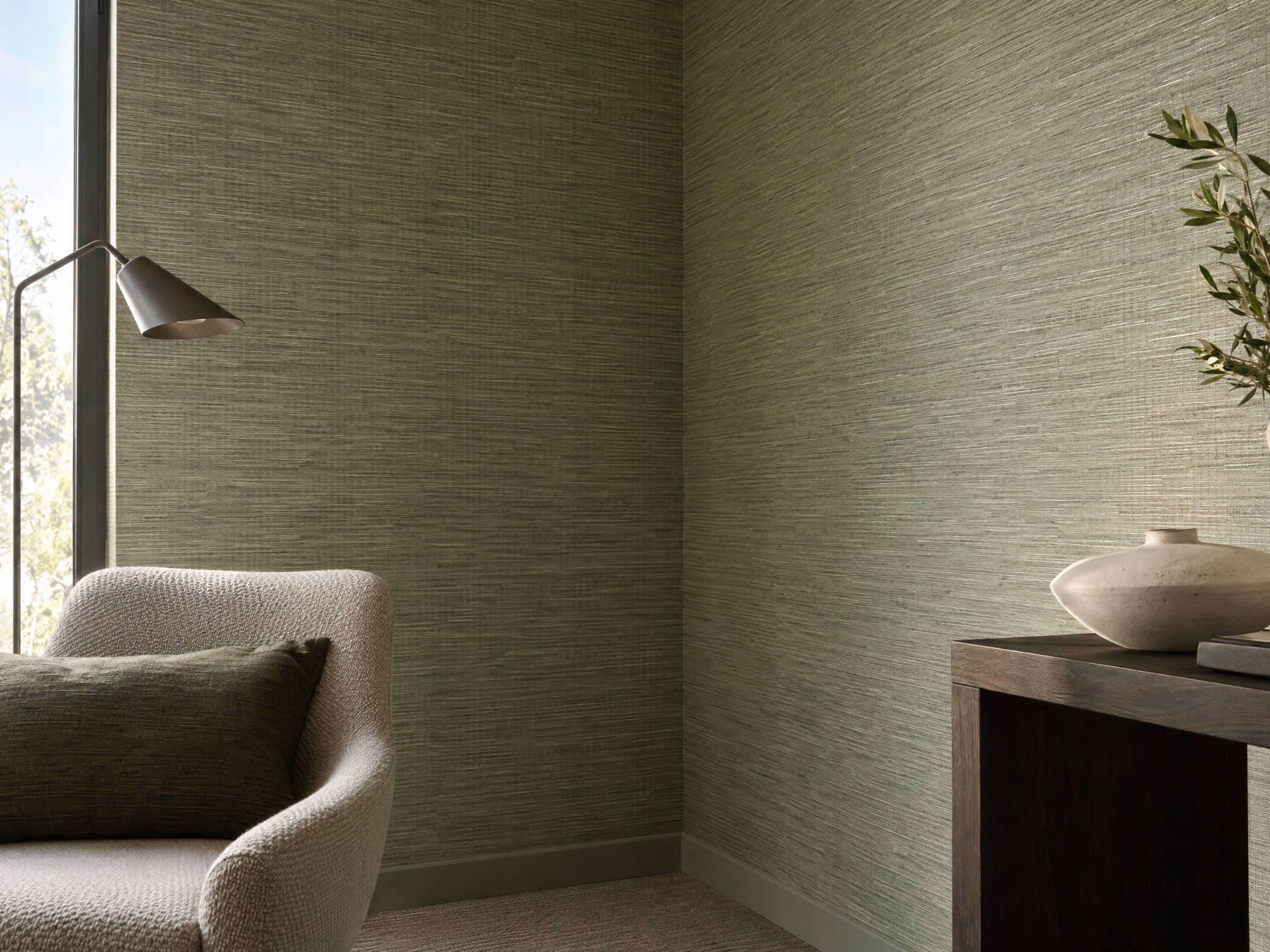 Woven-look wallcovering with a cleanly finished interior corner and baseboard transition